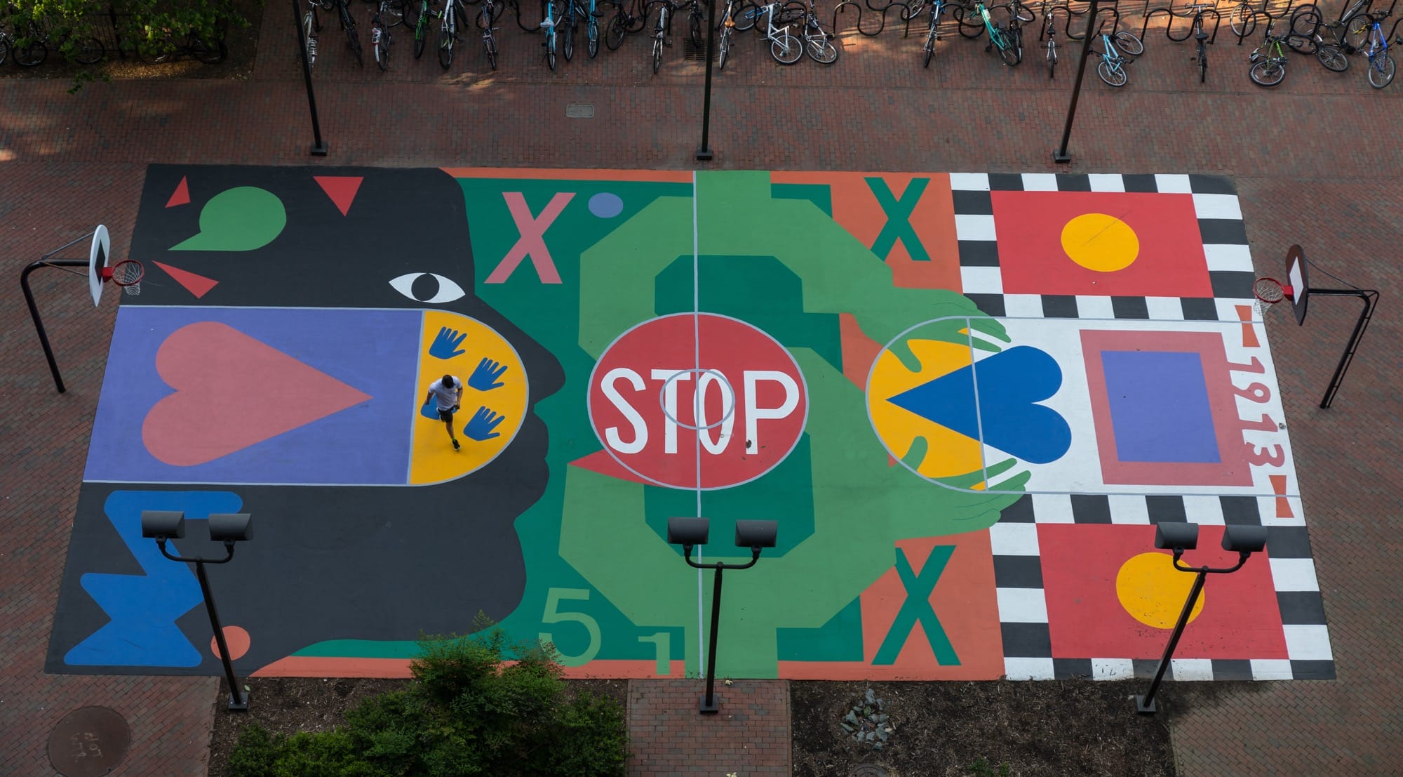 an aerial image of a painted basketball court by Nina Chanel Abney