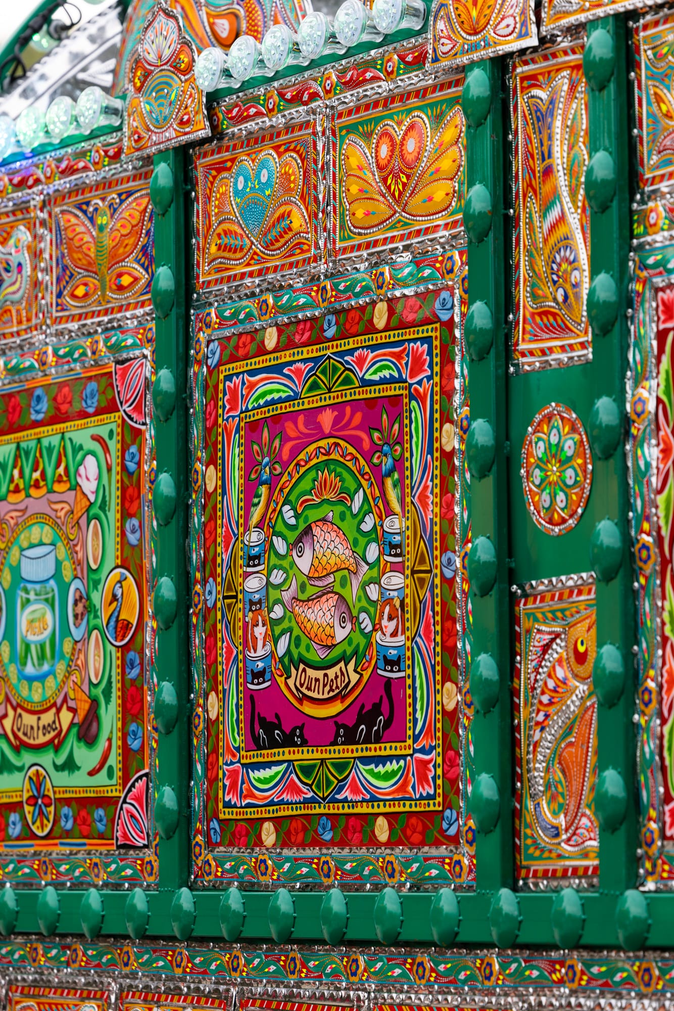 a detail of some paneling on a colorful van that has been transformed into an artwork