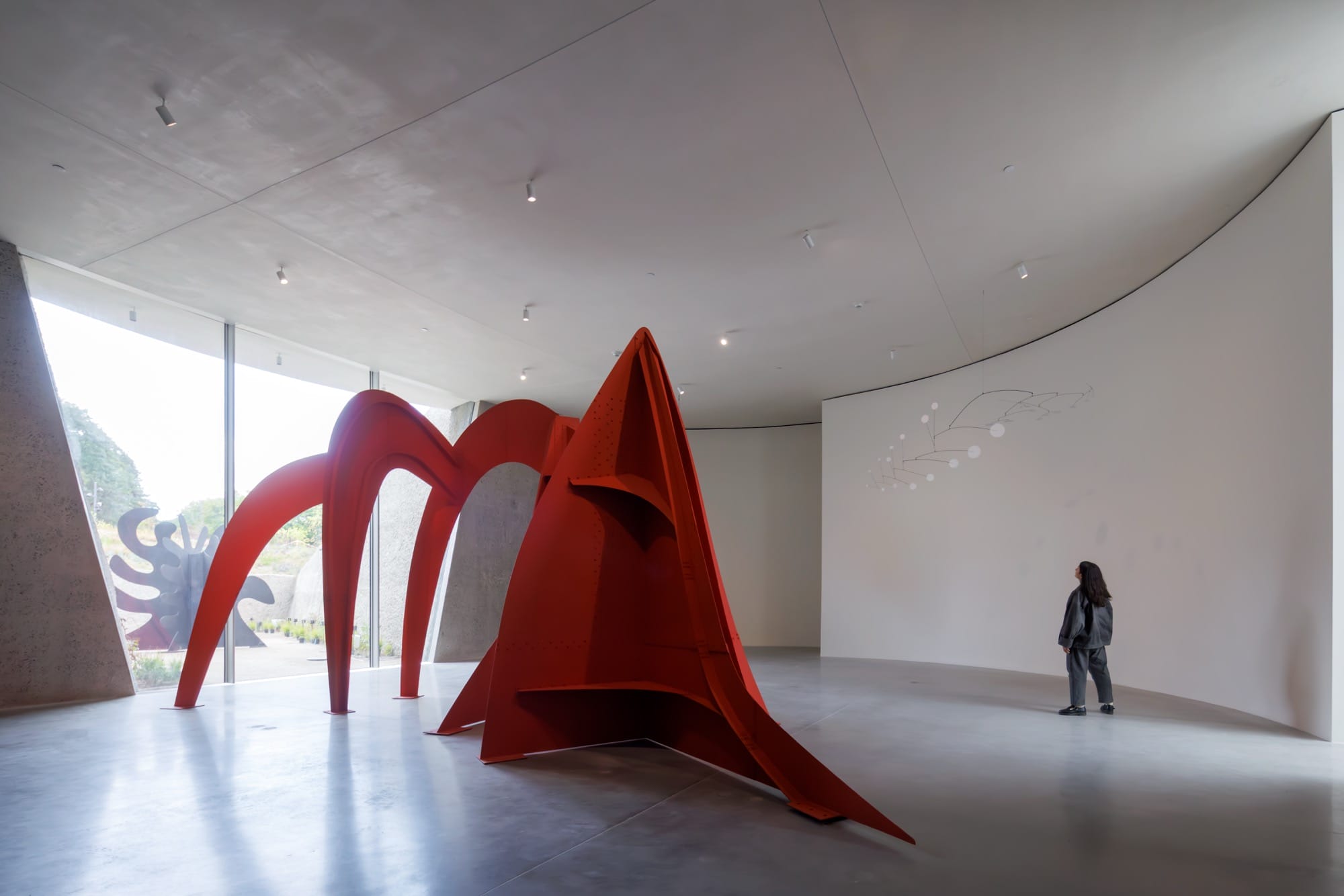 a large gallery space at Calder Gardens a large-scale sculpture in red