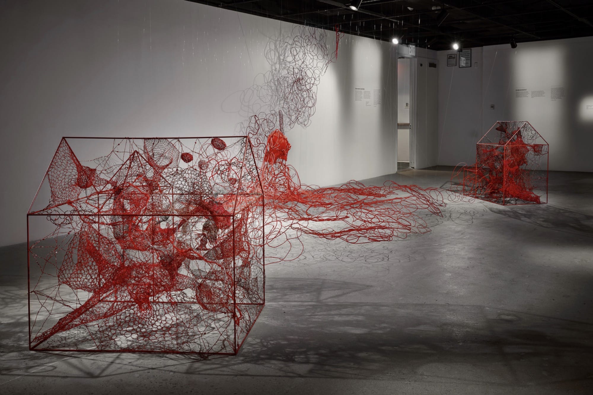 an installation of red fiber works by Chiharu Shiota