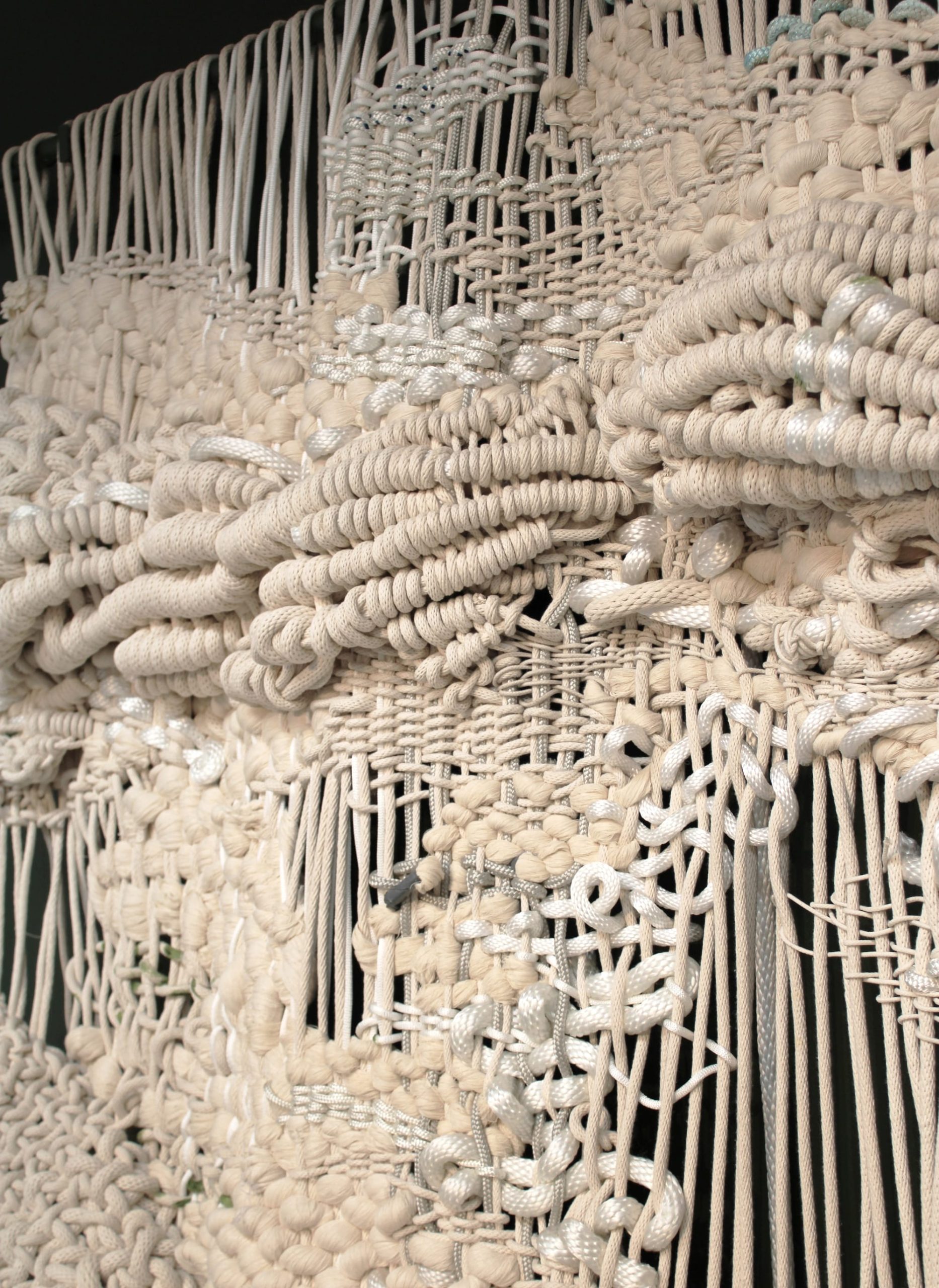 a detail image of a knotted white rope work by Jacqueline Surdell