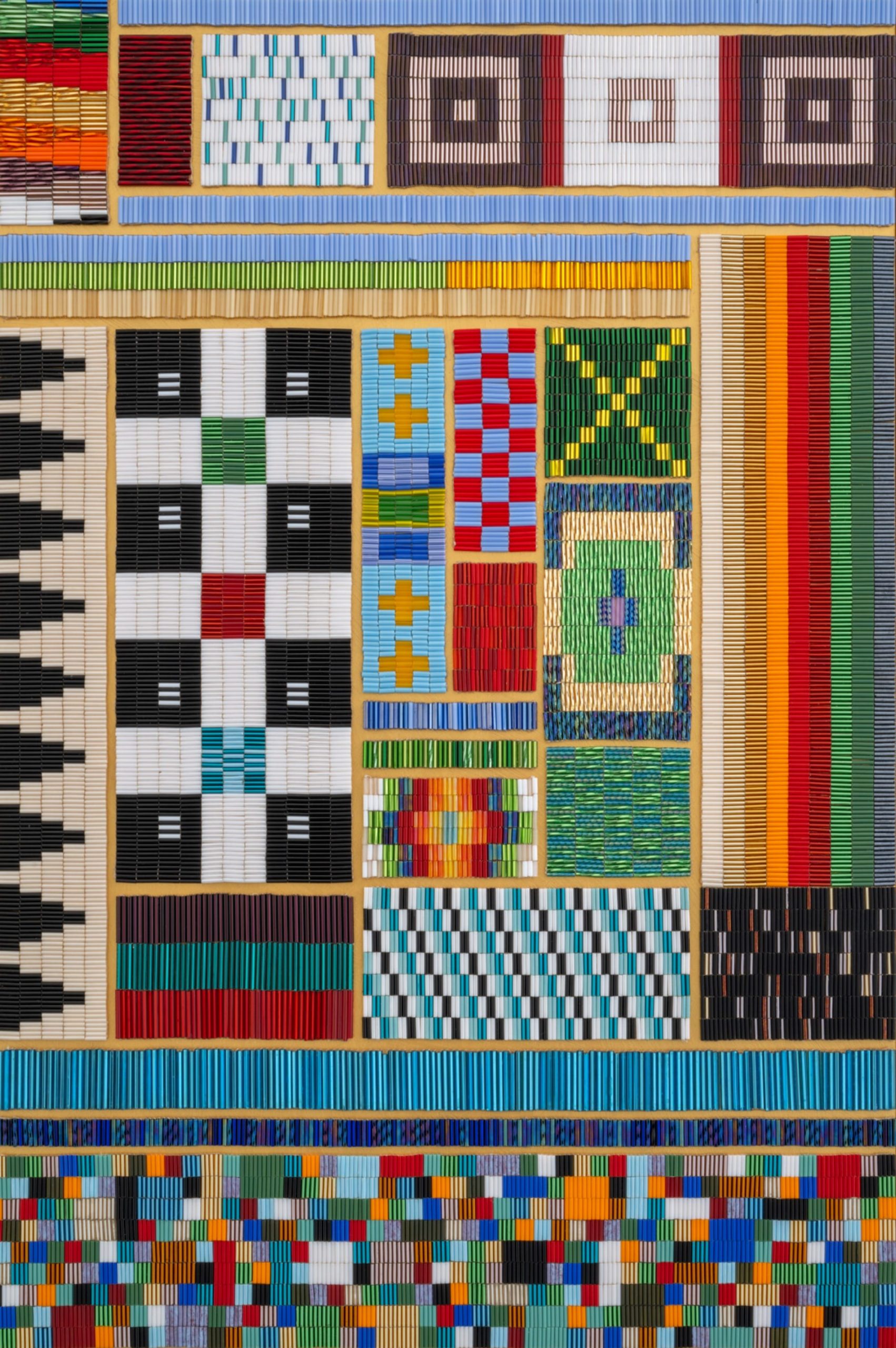 a detail of a geometric sculpture by Dyani White Hawk coated in patterns of beadwork