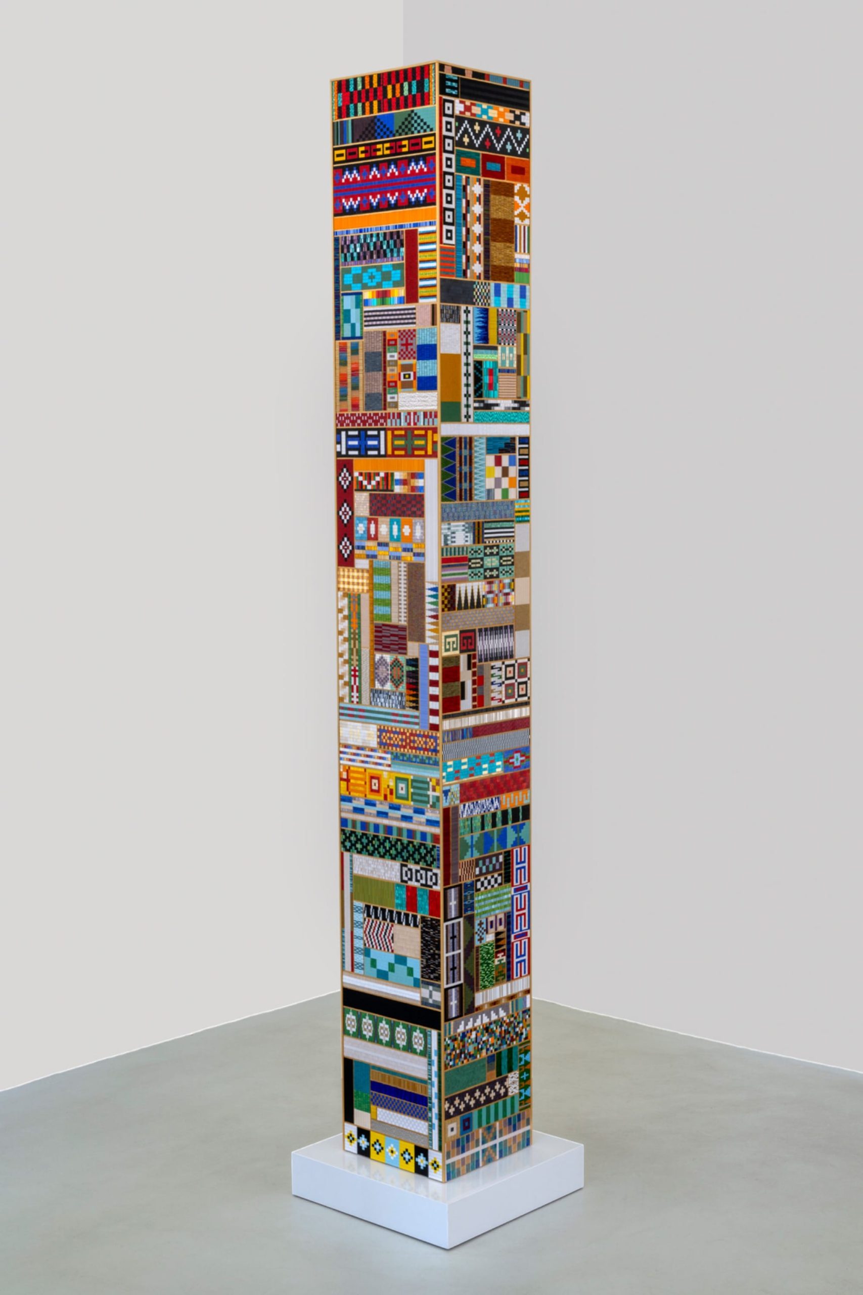 a columnar, geometric sculpture by Dyani White Hawk coated in patterns of beadwork